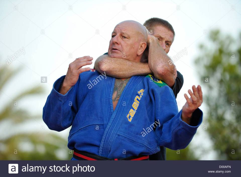 male-martial-arts-student-in-his-forties-has-his-teacher-in-his-fifties-D00AFN.jpg