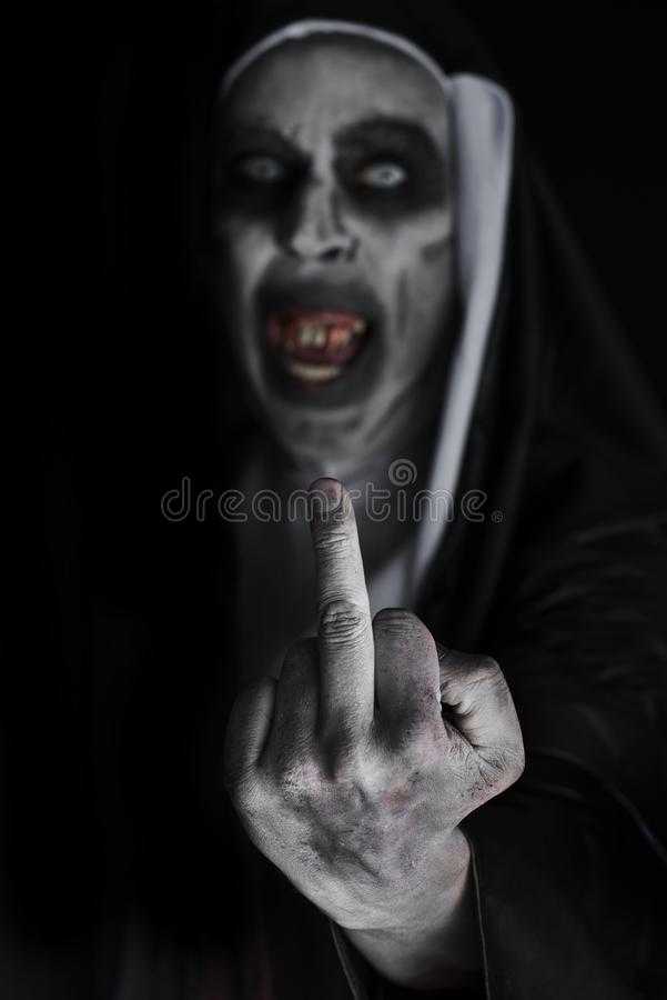 frightening-evil-nun-giving-finger-closeup-bloody-teeth-scary-eyes-wearing-typic.jpg