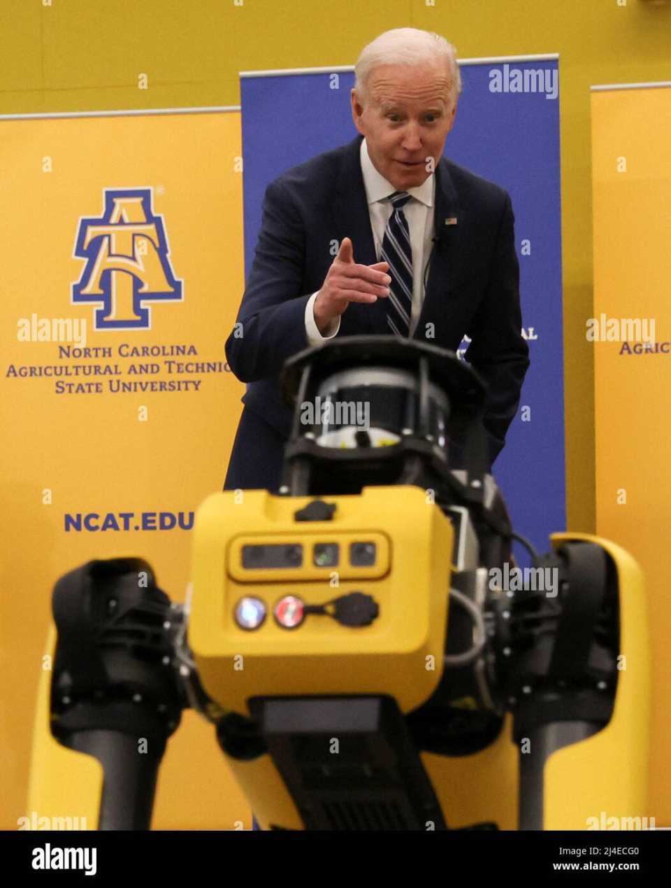 us-president-joe-biden-gestures-at-a-robot-dog-called-spot-at-the-robotics-lab-n.jpg