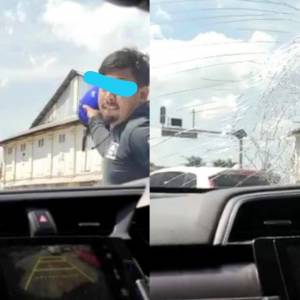 马来男子在路上与华人女生起冲突！男子怒敲车窗、砸车镜！