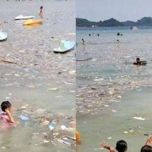 Pengunjung ‘seronok’ berenang dalam sampah di pantai